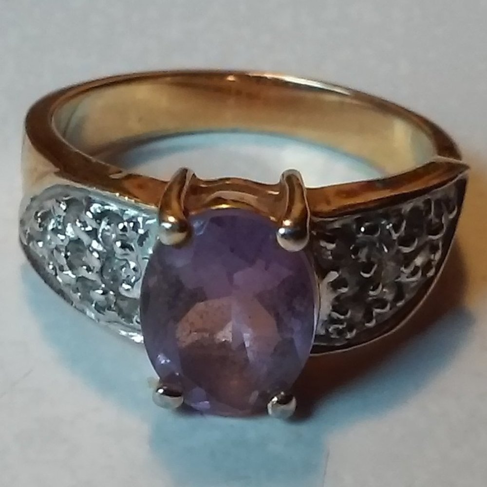 Gold Ring Size 7.5 to 8 Purple Stone with Many Clear Stones On Both Sides Of It